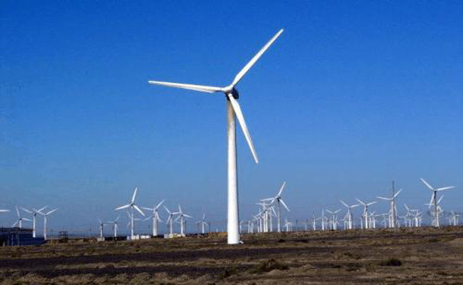 成片的風電站,已然成為一道風景。 成片的風電站,已然成為一道風景。